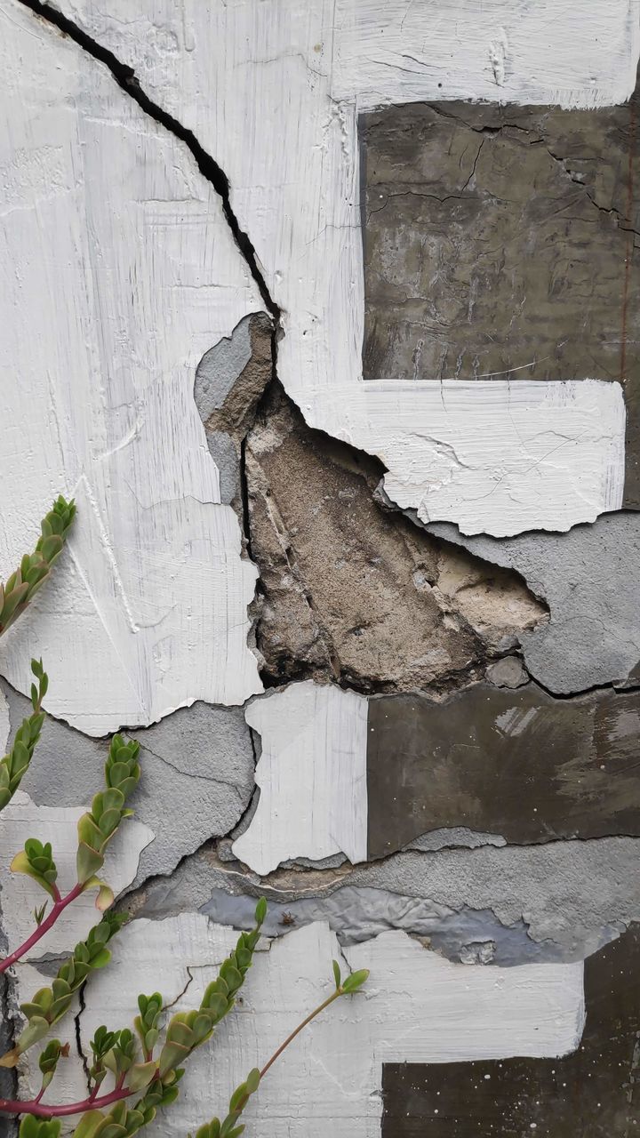 CLOSE-UP OF OLD WEATHERED WALL