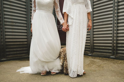 Brides holding hands