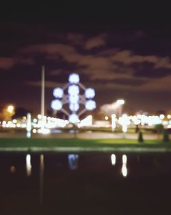 View of illuminated city against sky at night