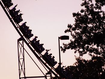 Low angle view of silhouette trees against clear sky