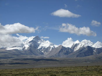 Scenic view of snowcapped mountains against sky