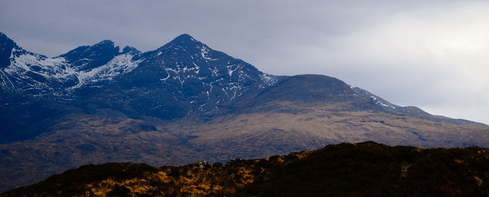 Scenic view of snowcapped mountains against sky