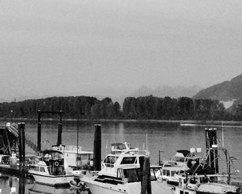 Boats moored in lake