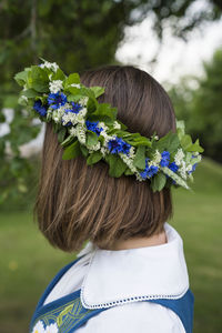 Woman wearing wreath of flowers