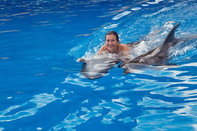 Woman swimming in pool