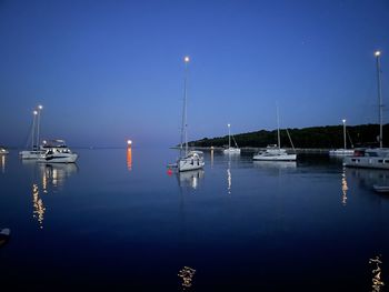 Boats moored at harbor