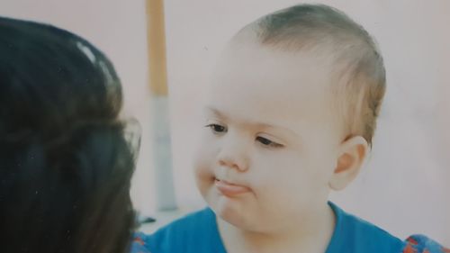 Portrait of cute boy looking away