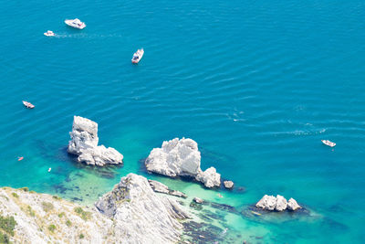 High angle view of rocks in sea