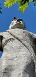 Low angle view of statue against clear blue sky