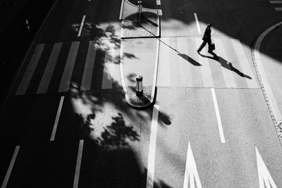 High angle view of people walking on road