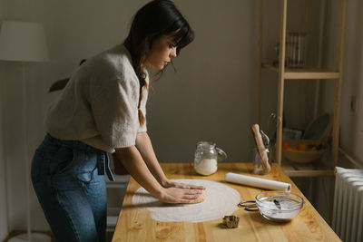 Young woman making christmas cookies