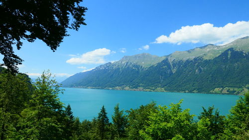 Scenic view of lake and mountains against sky