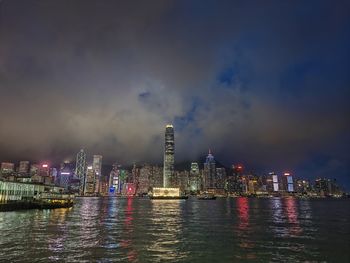 Illuminated city at waterfront