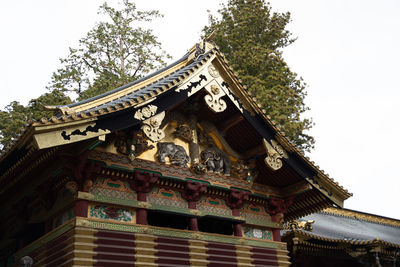 Low angle view of temple against building