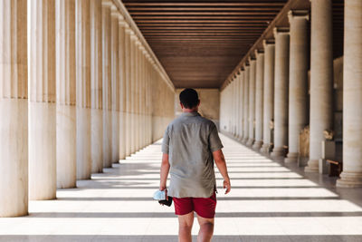 Rear view of woman walking on steps