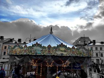 Low angle view of built structure against cloudy sky