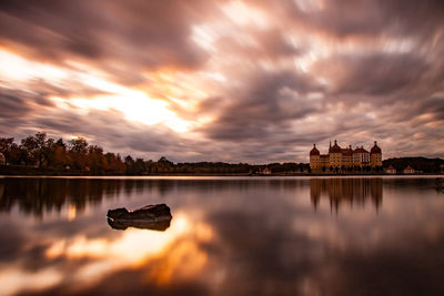 Boat in lake at sunset