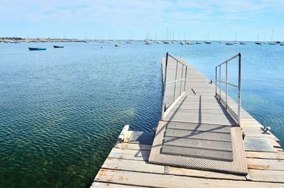 Pier over sea against sky