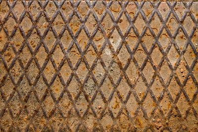 Full frame shot of chainlink fence against sky