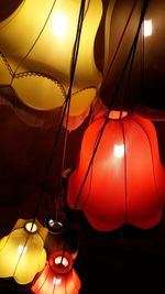 Close-up of illuminated lantern hanging at sunset