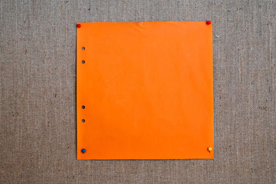 High angle view of orange on table against wall