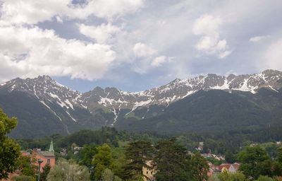 Scenic view of mountains against cloudy sky