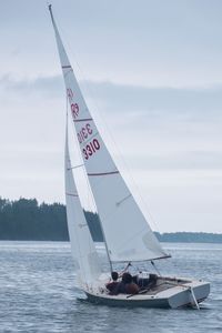 Sailboat on sea against sky