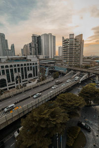 High angle view of city street and buildings against sky