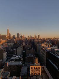 High angle view of buildings in city against clear sky