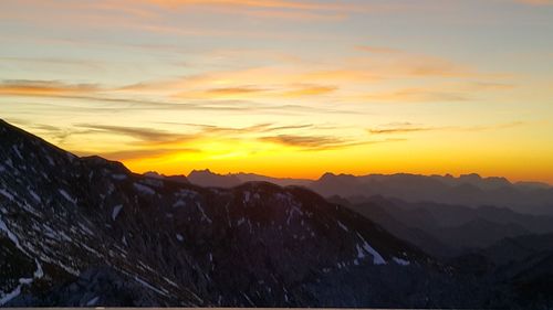 Scenic view of mountains against sky during sunset