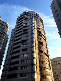 Low angle view of buildings against sky in city