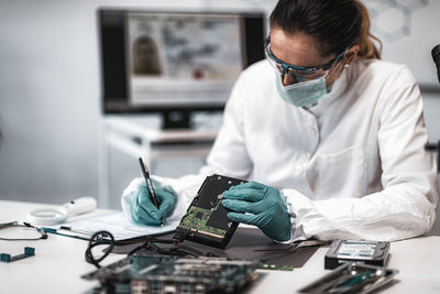 Female scientist working at crime laboratory