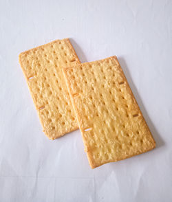 High angle view of bread on white table