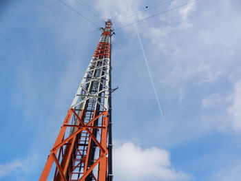 Low angle view of crane against sky