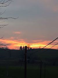 Silhouette landscape against sky during sunset