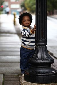 Portrait of boy standing outdoors