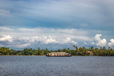 Backwater view at alleppey kerala india with blue sky and palm tree