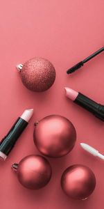High angle view of beauty products against pink background