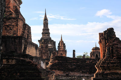 Old temple building against sky