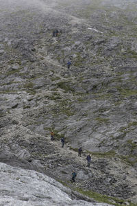 High angle view of people on rocks