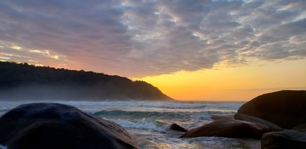 Scenic view of sea against sky during sunset