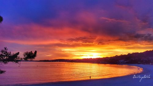 Scenic view of sea against romantic sky at sunset