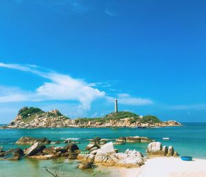 Scenic view of sea against blue sky