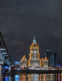 Illuminated buildings in city at night