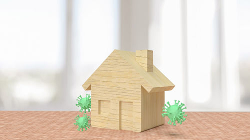 Close-up of toy on table against building