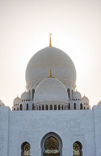 Low angle view of mosque against clear sky