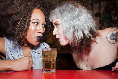 Young women hanging out at a bar