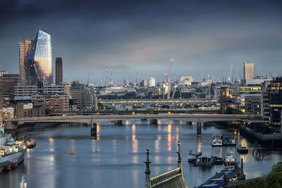 Bridge over river with buildings in background