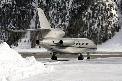 A private jet is ready to take off in the airport of st moritz switzerland in winter