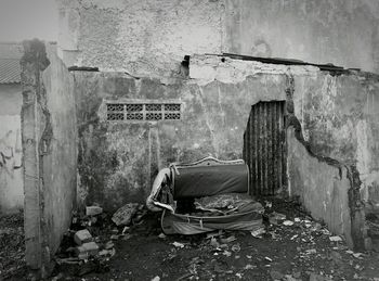 Abandoned house against wall